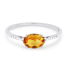 OVAL CUT CITRINE AND DIAMOND RING, .04 CT TW